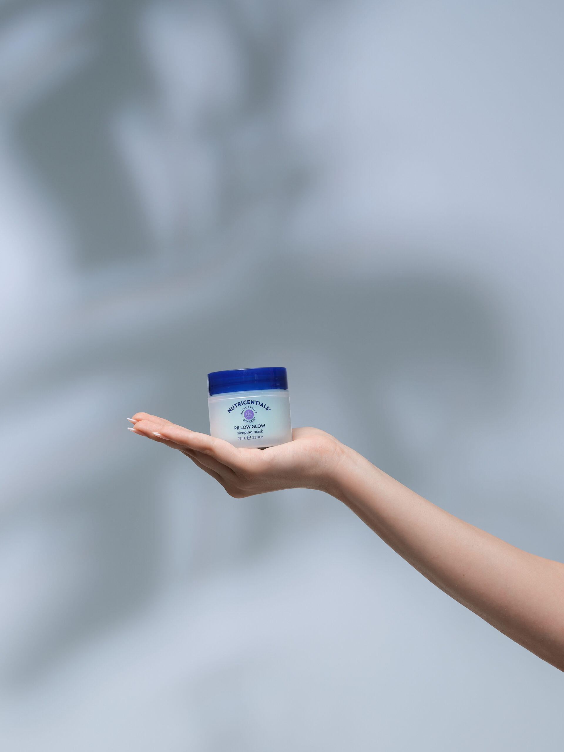 pillow-glow-sleeping-mask Nutricentials Pillow Glow Sleeping Mask held in a hand